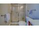 Cozy bathroom featuring a shower with glass doors and updated fixtures at 2749 Countryside Blvd # 4, Clearwater, FL 33761