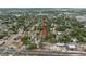 An aerial view points with a red arrow to the house, close to a busy road and neighborhood amenities at 2859 Dartmouth N Ave, St Petersburg, FL 33713