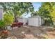 Relaxing backyard with a red cushioned bench and gravel space at 2859 Dartmouth N Ave, St Petersburg, FL 33713