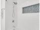 Modern bathroom features white subway tiles, shower with blue mosaic accent window, and chrome fixtures at 2859 Dartmouth N Ave, St Petersburg, FL 33713