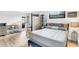 Comfortable bedroom boasts a stylish bed frame, warm wood flooring, natural light, and decorative accents at 2859 Dartmouth N Ave, St Petersburg, FL 33713