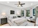 Cozy bedroom featuring a neutral palette, large windows, dark wood floors, and comfortable seating area at 2859 Dartmouth N Ave, St Petersburg, FL 33713