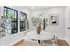 Stylish dining area with a marble table, matching chairs, and natural light from the windows at 2859 Dartmouth N Ave, St Petersburg, FL 33713