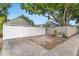 Long driveway with white fence and mature trees at 2859 Dartmouth N Ave, St Petersburg, FL 33713