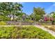 Charming home with manicured lawn, wooden fence, and lush landscaping at 2859 Dartmouth N Ave, St Petersburg, FL 33713