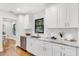 Bright kitchen featuring white cabinetry, stainless steel appliances, and marble countertops at 2859 Dartmouth N Ave, St Petersburg, FL 33713