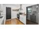 Modern kitchen featuring stainless steel appliances, white cabinetry, and marble countertops at 2859 Dartmouth N Ave, St Petersburg, FL 33713