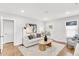 Inviting living room featuring hardwood floors, neutral decor, and abundant natural light at 2859 Dartmouth N Ave, St Petersburg, FL 33713