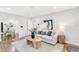 Cozy living room with hardwood floors, neutral decor, and seamless flow to the dining area at 2859 Dartmouth N Ave, St Petersburg, FL 33713