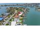 Beautiful waterfront property with private dock and lift, pool, plus close beach and city views for luxury coastal living at 31 Dolphin Dr, Treasure Island, FL 33706