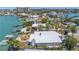 Stunning waterfront property with a private dock, pool, lush landscaping, and city skyline in an established neighborhood at 31 Dolphin Dr, Treasure Island, FL 33706