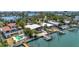 Waterfront property with a lush backyard, private dock, boat lift, and swimming pool in an established neighborhood at 31 Dolphin Dr, Treasure Island, FL 33706