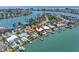 Stunning waterfront home with private dock and boat lift, pool, and lush landscaping with easy access to the Gulf at 31 Dolphin Dr, Treasure Island, FL 33706