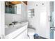 Clean bathroom featuring modern fixtures, sleek white tiles, and a floating vanity at 31 Dolphin Dr, Treasure Island, FL 33706