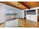 Bedroom with wood floors, balcony access providing water views, and an en-suite bathroom at 31 Dolphin Dr, Treasure Island, FL 33706