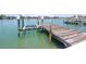 Private boat dock with boat lift offers easy access to open water for boating and fishing at 31 Dolphin Dr, Treasure Island, FL 33706