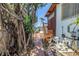 Home's exterior featuring a private walkway and a staircase that has access to the water at 31 Dolphin Dr, Treasure Island, FL 33706