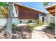 House featuring landscaped front yard and a stone walkway leading to the entrance at 31 Dolphin Dr, Treasure Island, FL 33706