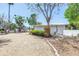 Charming single-story home featuring a well-kept yard and a light-colored gravel driveway at 31 Dolphin Dr, Treasure Island, FL 33706