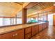 Hallway featuring wood floors and wall-to-wall cabinets providing ample storage space at 31 Dolphin Dr, Treasure Island, FL 33706