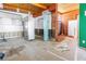 Picture of kitchen showcasing wooden ceilings, white walls, vintage refrigerator, and missing cabinets at 31 Dolphin Dr, Treasure Island, FL 33706