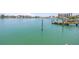 Expansive water view showcases the serene bay and a private dock, perfect for waterfront living at 31 Dolphin Dr, Treasure Island, FL 33706