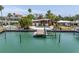 Beautiful waterfront home boasts private dock, boat lift, and scenic views of the tranquil bay at 31 Dolphin Dr, Treasure Island, FL 33706