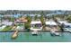Breathtaking waterfront view showcasing the tranquil bay, private docks, and surrounding luxury homes at 31 Dolphin Dr, Treasure Island, FL 33706