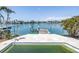 Waterfront pool and dock offering picturesque water views and waterfront living at its finest at 31 Dolphin Dr, Treasure Island, FL 33706