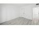Clean, bright bedroom with tile floors and a large closet in a neutral color palette at 3102 W Horatio St # 13, Tampa, FL 33609