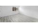 A bright bedroom with tile floors, fresh paint, and a window letting in natural light at 3102 W Horatio St # 13, Tampa, FL 33609