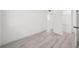 Clean bedroom boasting wood-look tile floors and an open closet at 3102 W Horatio St # 13, Tampa, FL 33609