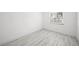 Well-lit bedroom with tile floors, natural light from a window, and freshly painted walls at 3102 W Horatio St # 13, Tampa, FL 33609