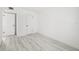 Bright bedroom featuring wood-look tile floors and closet doors at 3102 W Horatio St # 13, Tampa, FL 33609