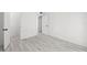 Bright bedroom with tile floors and fresh white paint leading to other rooms at 3102 W Horatio St # 13, Tampa, FL 33609
