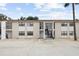 Apartment building exterior featuring multi-level access, parking, and neutral color scheme at 3102 W Horatio St # 13, Tampa, FL 33609