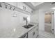 Kitchen view showing stainless steel appliances, countertop and view to the bathroom and living area at 3102 W Horatio St # 13, Tampa, FL 33609