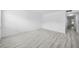 Living room with wood-look tile flooring and light walls at 3102 W Horatio St # 13, Tampa, FL 33609