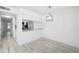 View of the living room showing the kitchen and lighting fixture at 3102 W Horatio St # 13, Tampa, FL 33609