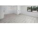 Bright living room with tile floors and a large window with blinds at 3102 W Horatio St # 13, Tampa, FL 33609