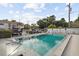 Community pool featuring clear blue water and lounge chairs at 3102 W Horatio St # 13, Tampa, FL 33609