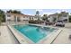 Community pool in a fenced in area by the condo buildings and parking area at 3102 W Horatio St # 13, Tampa, FL 33609