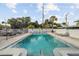 Community pool offering lounge seating and privacy fencing at 3102 W Horatio St # 13, Tampa, FL 33609