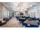 Elegant community room featuring decorative lighting, dining tables, seating and a bar at 31596 Griffin Sands Ln, San Antonio, FL 33576