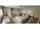 Bedroom featuring a queen-sized bed, built-in storage, and natural light from the windows at 3301 Alt 19 # 500, Palm Harbor, FL 34683