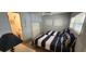 Bedroom featuring two twin beds with striped bedding and matching pillows, plus ensuite bathroom at 3301 Alt 19 # 500, Palm Harbor, FL 34683