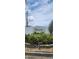 Westwind 55+ community sign with vibrant foliage at 3301 Alt 19 # 500, Palm Harbor, FL 34683