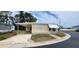 Charming single-story home features a covered parking area and a well-maintained front yard at 3301 Alt 19 # 500, Palm Harbor, FL 34683