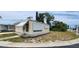 This cozy home boasts a sunny disposition with its light yellow siding and mature landscaping at 3301 Alt 19 # 500, Palm Harbor, FL 34683