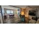 Open-concept living area seamlessly connects the dining and sitting spaces at 3301 Alt 19 # 500, Palm Harbor, FL 34683